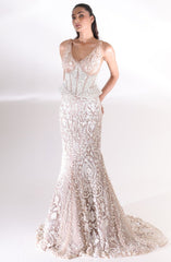 Champagne ivory Aurelia Pearl Mermaid Lehenga by DEEPANSHI MASSEY LABEL featuring intricate floral embroidery, a pearl-embellished corset blouse, fitted mermaid silhouette and a dramatic trailing hem.