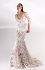 Three-quarter view of the champagne ivory Aurelia Pearl Mermaid Lehenga showcasing intricate floral embroidery, pearl embellishments, a fitted silhouette and an elegant bridal train by DEEPANSHI MASSEY LABEL.