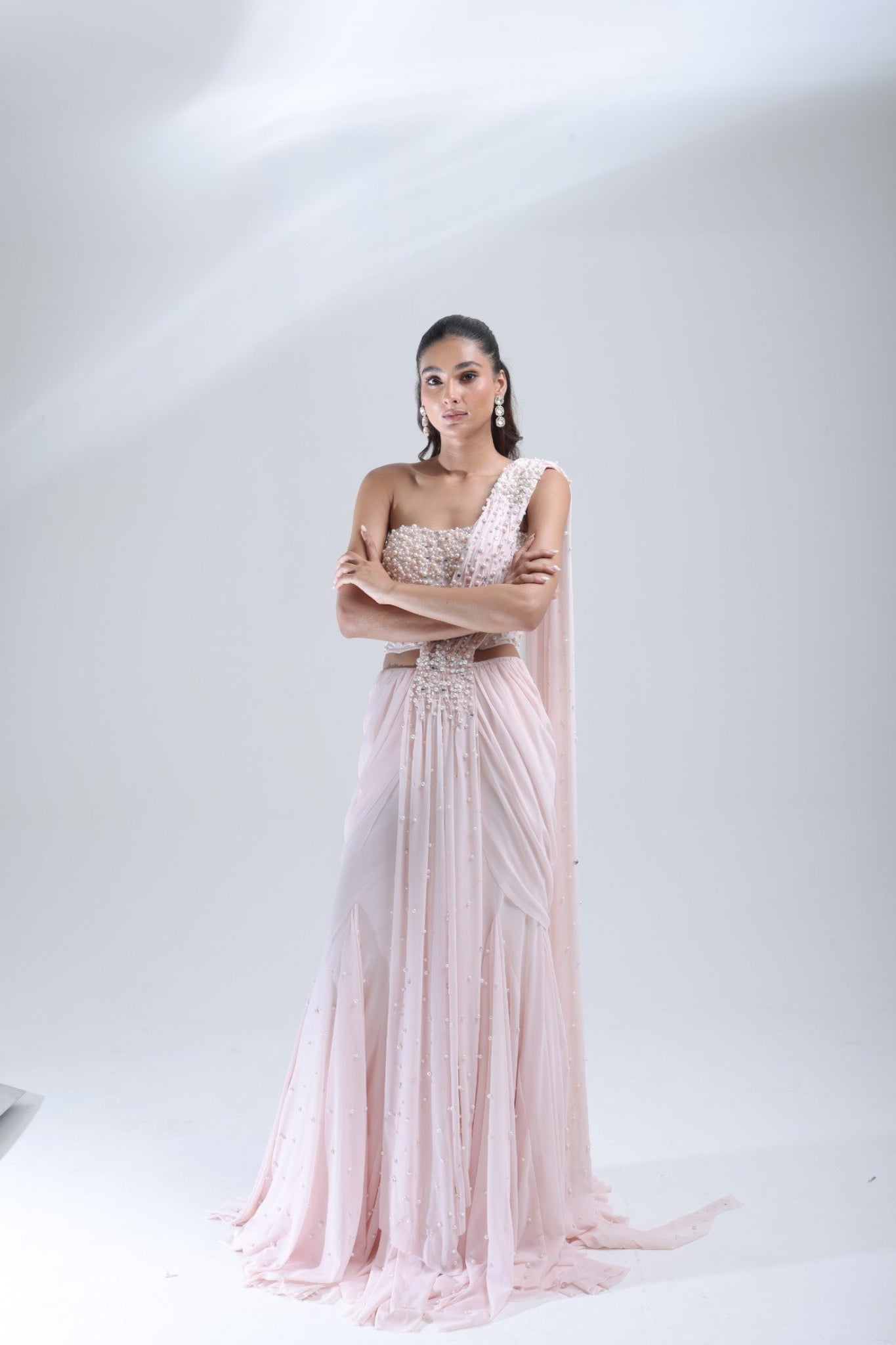 DEEPANSHI MASSEY LABEL baby pink pearl saree lehenga showing the full drape, embellished blouse and scattered pearl detailing