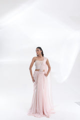 DEEPANSHI MASSEY LABEL baby pink saree lehenga with pearl-work blouse and draped pallu, elegant full-length three-quarter pose