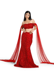 Full-length front view of the Crimson Reign Lehenga by DEEPANSHI MASSEY LABEL featuring a crimson red mermaid skirt, intricately embroidered off-shoulder blouse and dramatic detachable net trail sleeves.